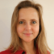 Photo of a woman with blonde hair in a red shirt