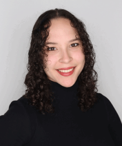 photo of a woman with dark hair wearing a black top